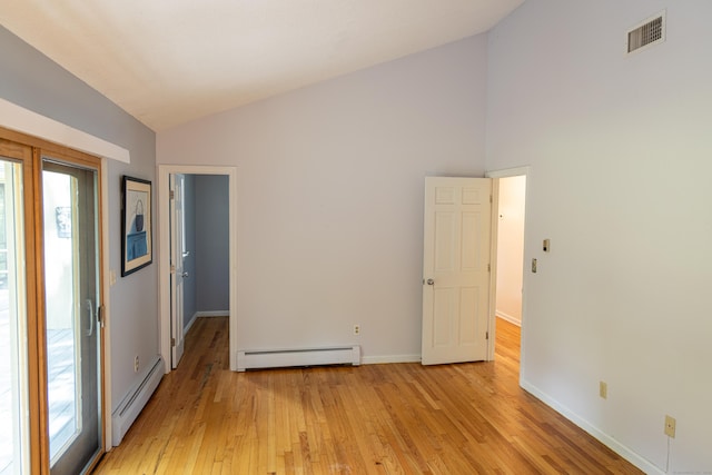 472 Saw Mill Rd, Guilford, CT 06437 - empty room with baseboard heating, light wood finished floors, and high vaulted ceiling