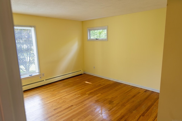 472 Saw Mill Rd, Guilford, CT 06437 - spare room with a baseboard radiator and light wood-style floors