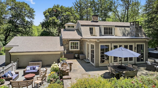 66 Little Brook Rd, Wilton, CT 06897 - rear view of property with an outdoor living space, a chimney, a patio, and stone siding