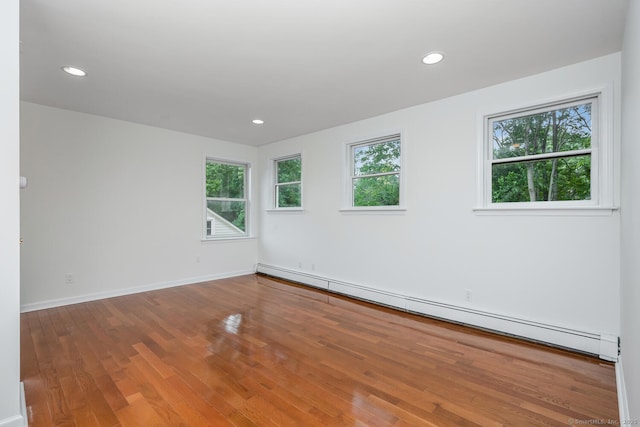 254 W Ave, Darien, CT 06820 - empty room with baseboard heating, wood finished floors, and recessed lighting