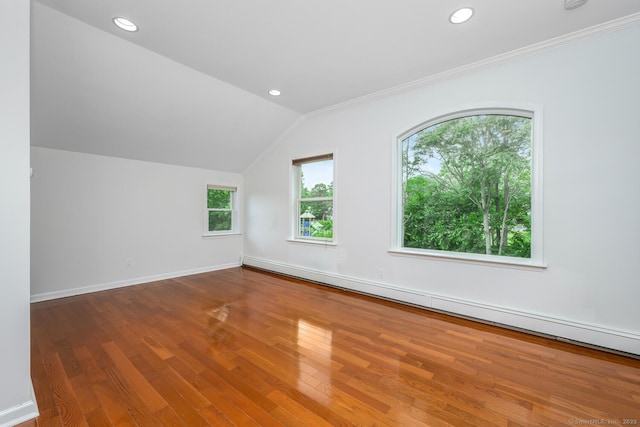 254 W Ave, Darien, CT 06820 - empty room with wood finished floors, baseboard heating, vaulted ceiling, recessed lighting, and ornamental molding