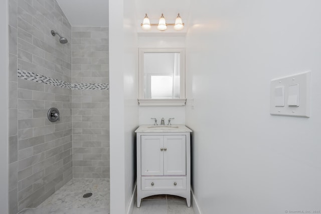 254 W Ave, Darien, CT 06820 - bathroom with tiled shower, vanity, and tile patterned floors