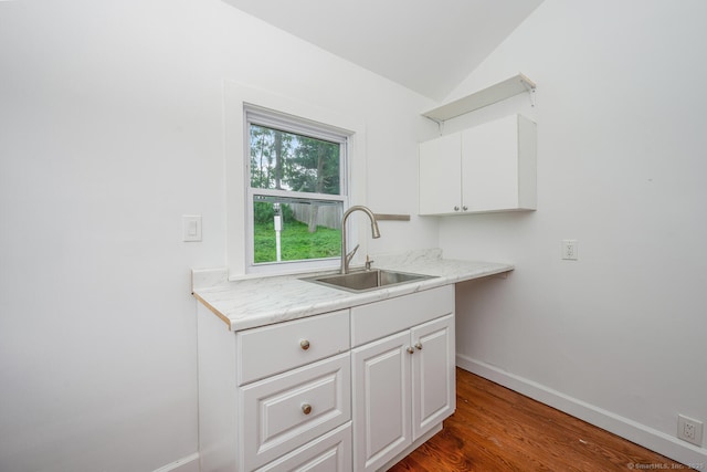 254 W Ave, Darien, CT 06820 - kitchen with lofted ceiling, white cabinetry, light countertops, and wood finished floors