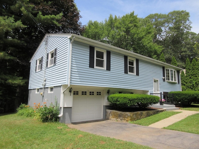 11 Ledgewood Dr, Ledyard, CT 06335 - raised ranch featuring an attached garage and concrete driveway