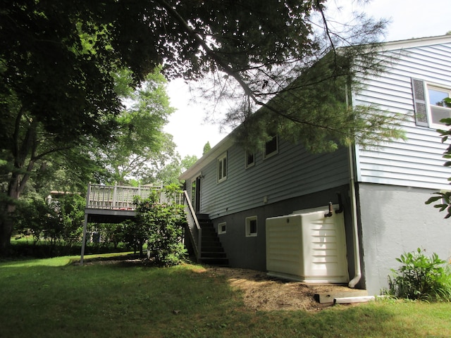 11 Ledgewood Dr, Ledyard, CT 06335 - back of property featuring stairs, a deck, and a lawn