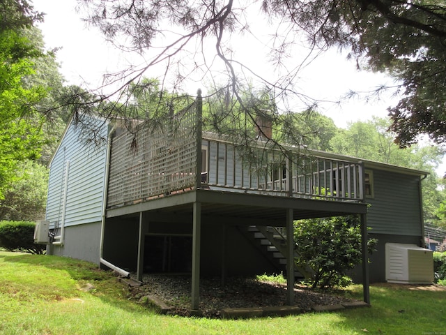 11 Ledgewood Dr, Ledyard, CT 06335 - back of property featuring a deck, a lawn, and stairs
