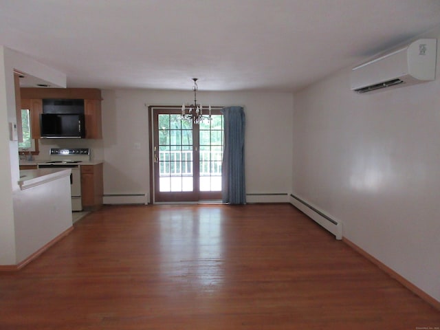 11 Ledgewood Dr, Ledyard, CT 06335 - unfurnished dining area with a wall mounted AC, a baseboard radiator, a chandelier, and light wood-type flooring