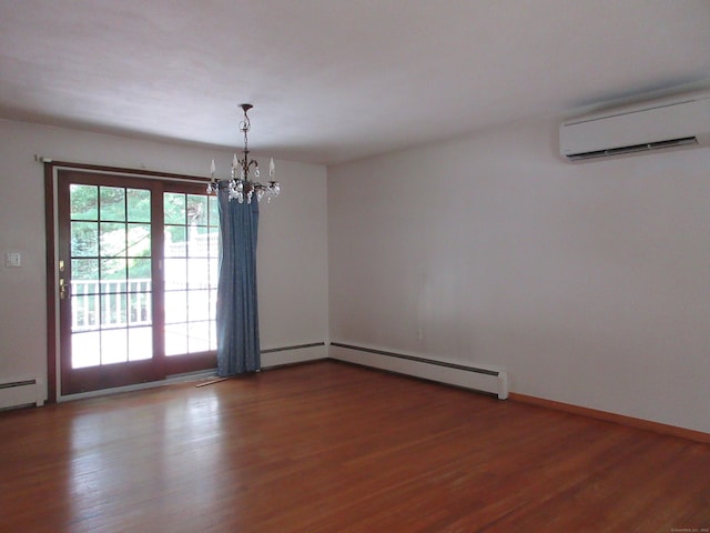 11 Ledgewood Dr, Ledyard, CT 06335 - empty room featuring a wall unit AC, a baseboard heating unit, a chandelier, and wood finished floors