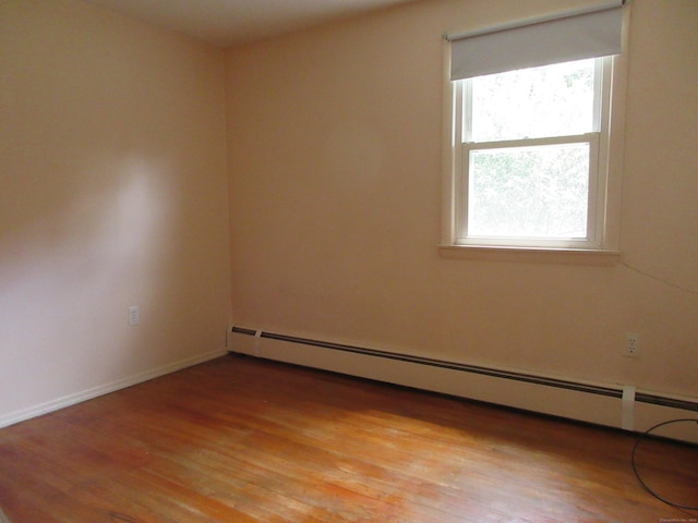 11 Ledgewood Dr, Ledyard, CT 06335 - empty room featuring a baseboard radiator and light wood-style flooring