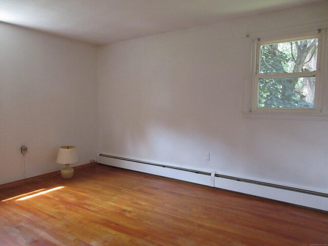 11 Ledgewood Dr, Ledyard, CT 06335 - empty room with a baseboard radiator and light wood finished floors