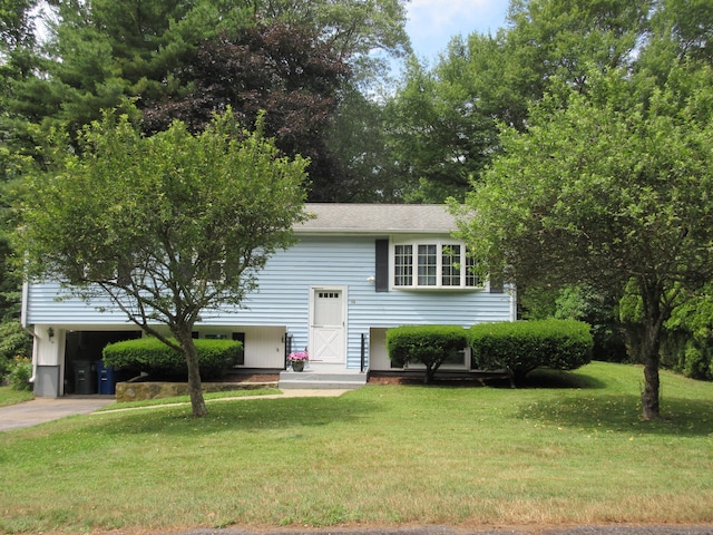 11 Ledgewood Dr, Ledyard, CT 06335 - bi-level home with a carport, a front yard, and driveway