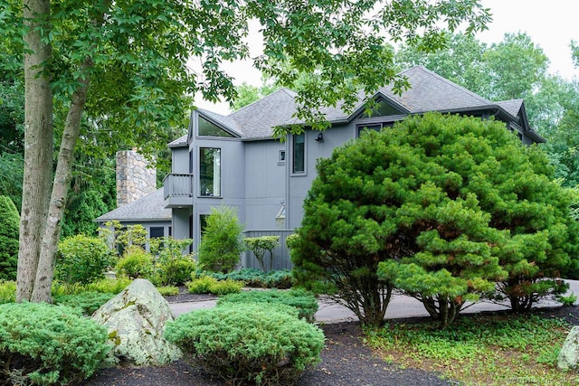 19 Money Point Rd, Stonington, CT 06355 - view of front of house with a shingled roof and a chimney