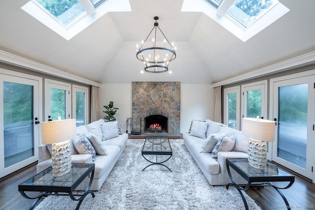 19 Money Point Rd, Stonington, CT 06355 - living room with a skylight, wood finished floors, vaulted ceiling, a chandelier, and a fireplace