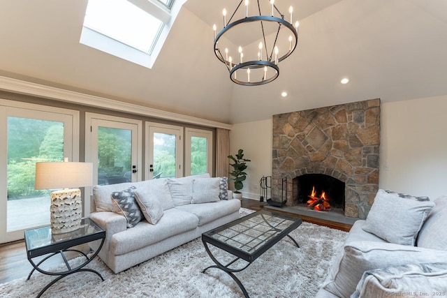 19 Money Point Rd, Stonington, CT 06355 - living area with a skylight, high vaulted ceiling, a fireplace, a chandelier, and recessed lighting