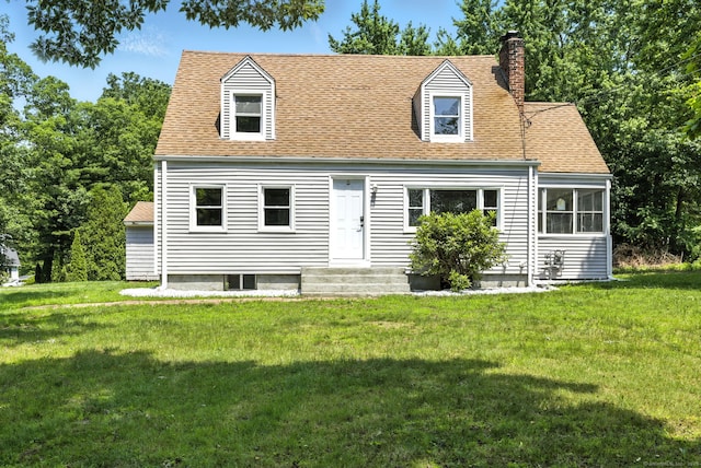 780 Park Ave, Windsor, CT 06095 - cape cod home with a chimney, a front lawn, and roof with shingles