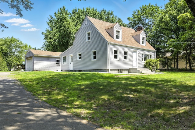 780 Park Ave, Windsor, CT 06095 - view of front of property featuring a chimney, a front yard, a shingled roof, and an outbuilding