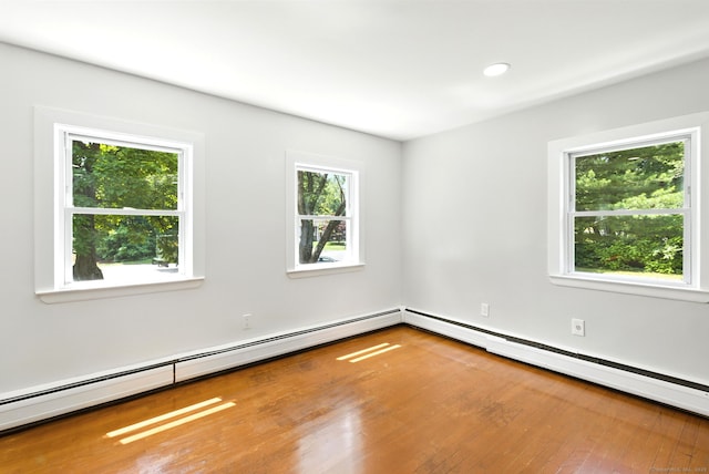780 Park Ave, Windsor, CT 06095 - unfurnished room featuring healthy amount of natural light, wood finished floors, a baseboard heating unit, and recessed lighting