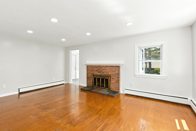 780 Park Ave, Windsor, CT 06095 - unfurnished living room featuring a baseboard radiator, wood finished floors, recessed lighting, and a fireplace