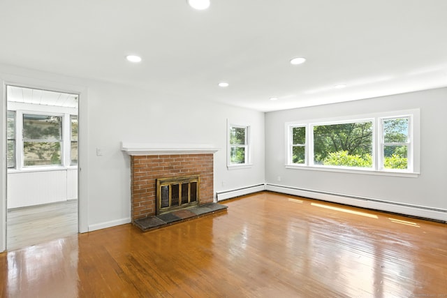 780 Park Ave, Windsor, CT 06095 - unfurnished living room featuring wood finished floors, a brick fireplace, baseboard heating, and recessed lighting