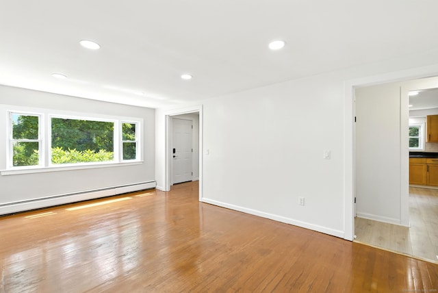 780 Park Ave, Windsor, CT 06095 - spare room with light wood-style floors, recessed lighting, and a baseboard heating unit