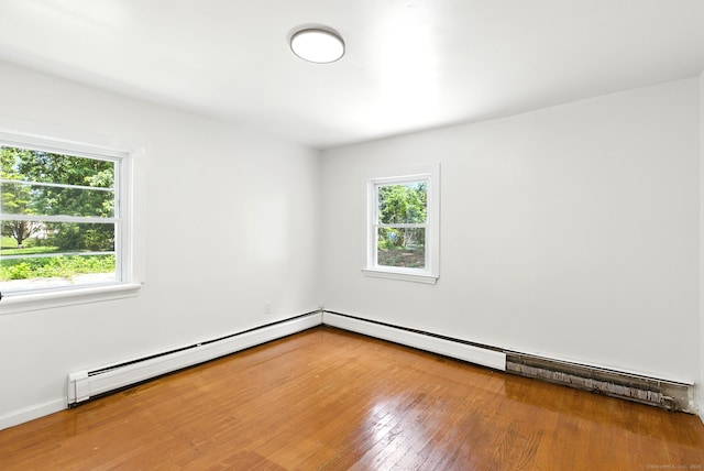 780 Park Ave, Windsor, CT 06095 - spare room featuring healthy amount of natural light, wood finished floors, and baseboard heating