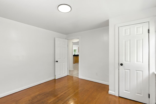 780 Park Ave, Windsor, CT 06095 - unfurnished bedroom featuring wood finished floors and baseboards