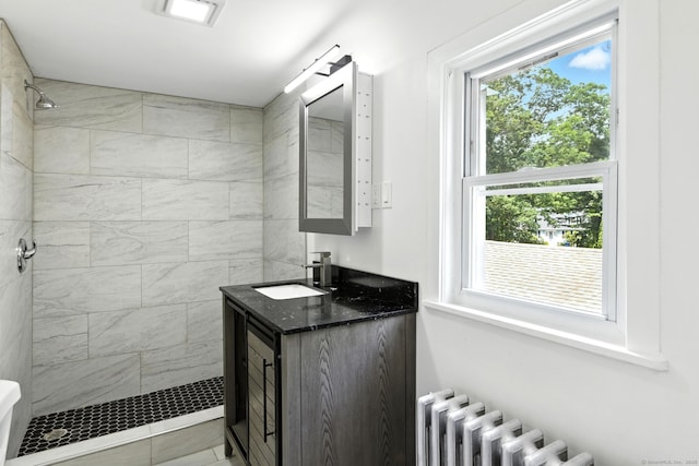 780 Park Ave, Windsor, CT 06095 - full bathroom featuring radiator, a tile shower, and vanity