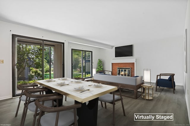 241 Heritage Vlg Unit C, Southbury, CT 06488 - dining area featuring wood finished floors and a fireplace