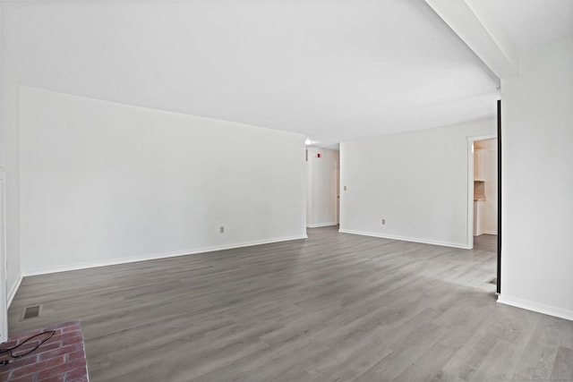 241 Heritage Vlg Unit C, Southbury, CT 06488 - unfurnished living room with wood finished floors and baseboards