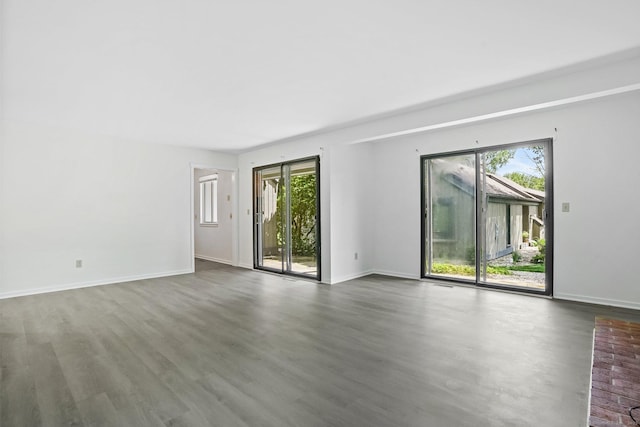 241 Heritage Vlg Unit C, Southbury, CT 06488 - empty room with plenty of natural light and wood finished floors