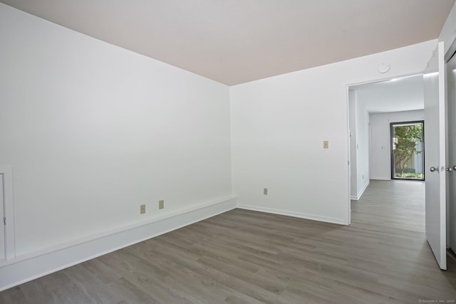 241 Heritage Vlg Unit C, Southbury, CT 06488 - empty room featuring wood finished floors and baseboards