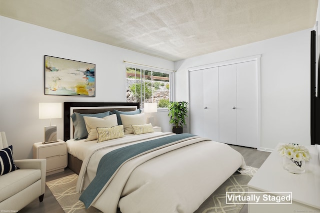 241 Heritage Vlg Unit C, Southbury, CT 06488 - bedroom with wood finished floors, a closet, and a textured ceiling