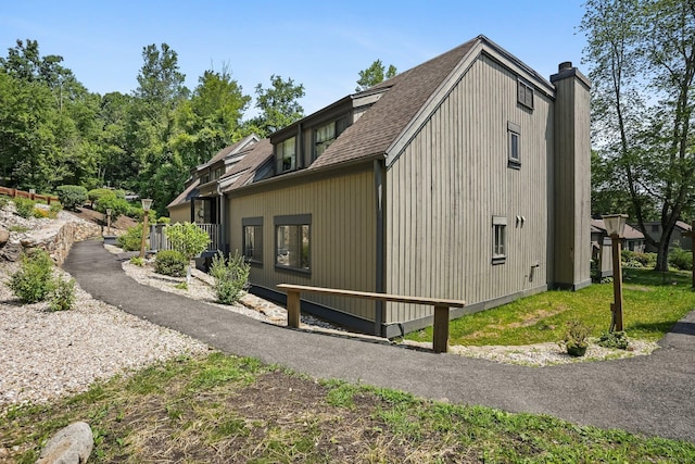 241 Heritage Vlg Unit C, Southbury, CT 06488 - view of property exterior with a shingled roof
