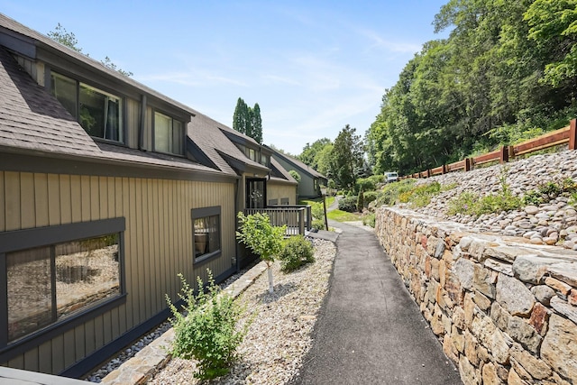 241 Heritage Vlg Unit C, Southbury, CT 06488 - view of property exterior featuring a shingled roof