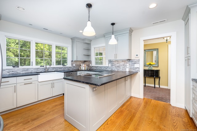 101 Tallmadge Ln, Litchfield, CT 06759 - kitchen featuring open shelves, a peninsula, tasteful backsplash, dark countertops, and recessed lighting
