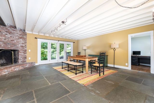 101 Tallmadge Ln, Litchfield, CT 06759 - dining room featuring stone tile flooring, beamed ceiling, and a fireplace