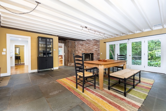 101 Tallmadge Ln, Litchfield, CT 06759 - dining area with a fireplace, beam ceiling, and french doors