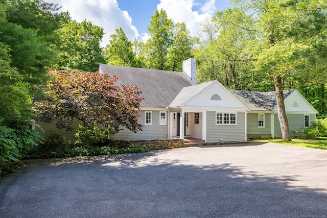 101 Tallmadge Ln, Litchfield, CT 06759 - view of front facade with a chimney and asphalt driveway