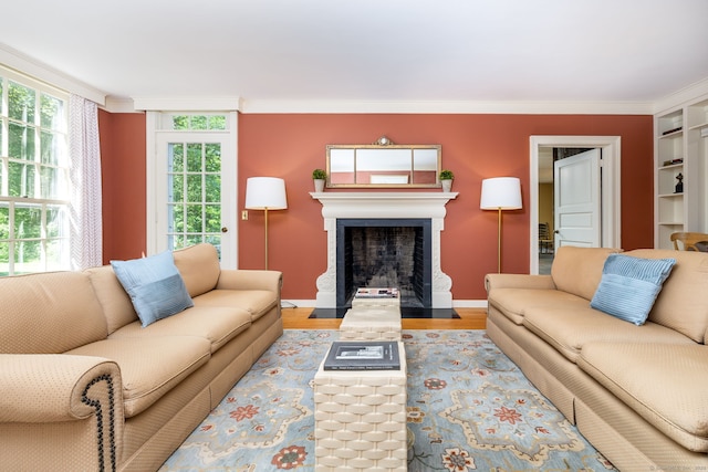 101 Tallmadge Ln, Litchfield, CT 06759 - living room with wood finished floors, a fireplace with flush hearth, and ornamental molding