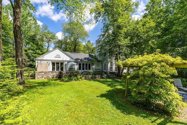 101 Tallmadge Ln, Litchfield, CT 06759 - view of front facade featuring stone siding, a front lawn, and a chimney