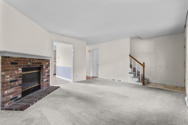 11 Bay Path Way Unit 11, Branford, CT 06405 - unfurnished living room with carpet flooring, stairs, and a brick fireplace