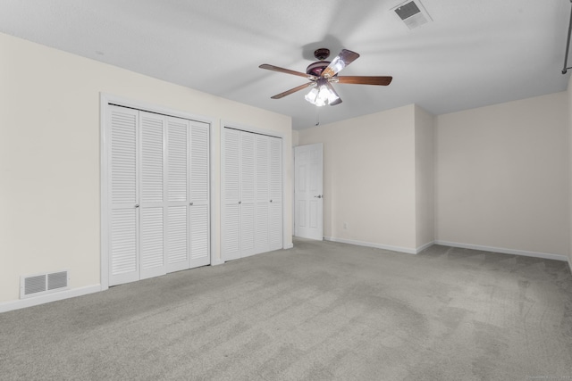 11 Bay Path Way Unit 11, Branford, CT 06405 - unfurnished bedroom featuring carpet floors, multiple closets, and ceiling fan