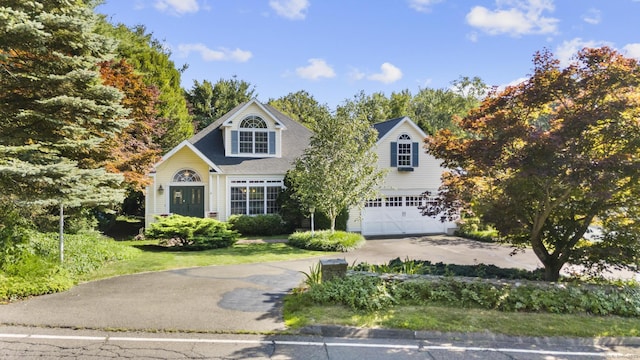 50 Middlebrooks Ave, Trumbull, CT 06611 - traditional home with an attached garage, driveway, and a front lawn