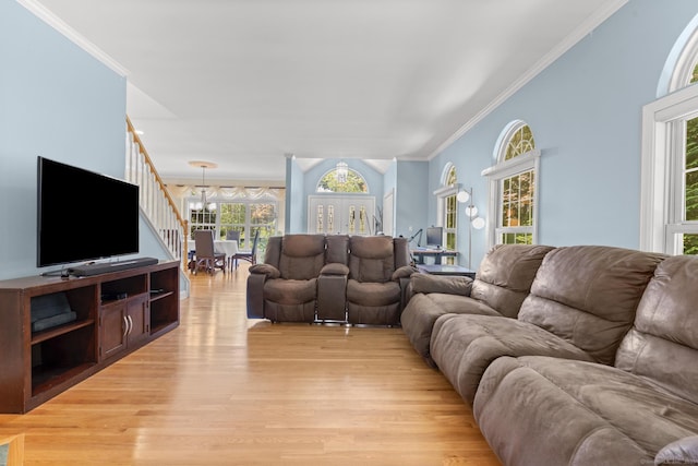 50 Middlebrooks Ave, Trumbull, CT 06611 - living area with light wood finished floors, a chandelier, and crown molding