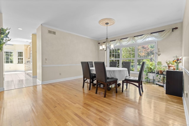 50 Middlebrooks Ave, Trumbull, CT 06611 - dining area with light wood-type flooring, crown molding, a chandelier, and recessed lighting