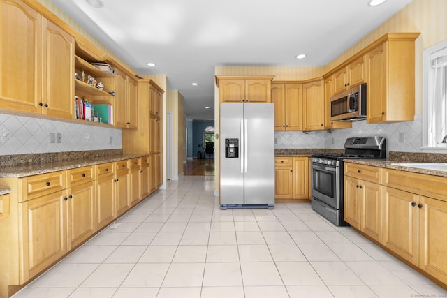50 Middlebrooks Ave, Trumbull, CT 06611 - kitchen with appliances with stainless steel finishes, tasteful backsplash, light tile patterned floors, open shelves, and dark stone countertops