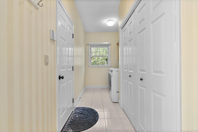50 Middlebrooks Ave, Trumbull, CT 06611 - laundry room featuring wallpapered walls, washer / dryer, and light tile patterned flooring