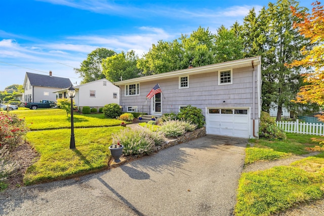 34 Fleming Ct, Groton, CT 06340 - split foyer home with driveway and an attached garage