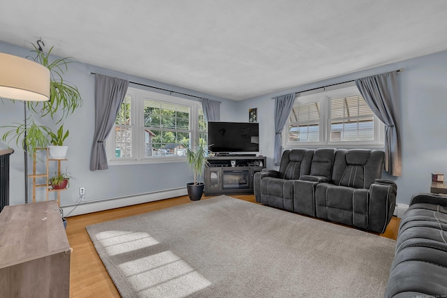 34 Fleming Ct, Groton, CT 06340 - living area featuring a baseboard heating unit and wood finished floors