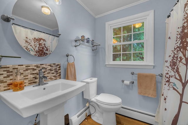 34 Fleming Ct, Groton, CT 06340 - bathroom with a baseboard heating unit, wood finished floors, backsplash, and ornamental molding